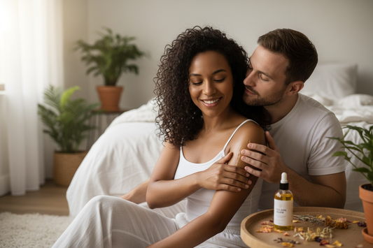 A biracial woman putting on body oil and her white husband smelling it.